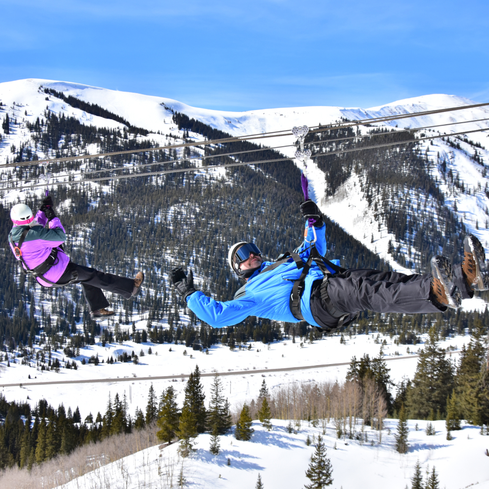 people in the mountains on a Colorado zipline