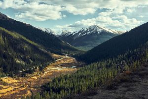 view of a valley and mountain from a hiking trail near Leadville, CO